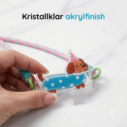 Mobiltelefonklämma med djurmotiv och handledsrem